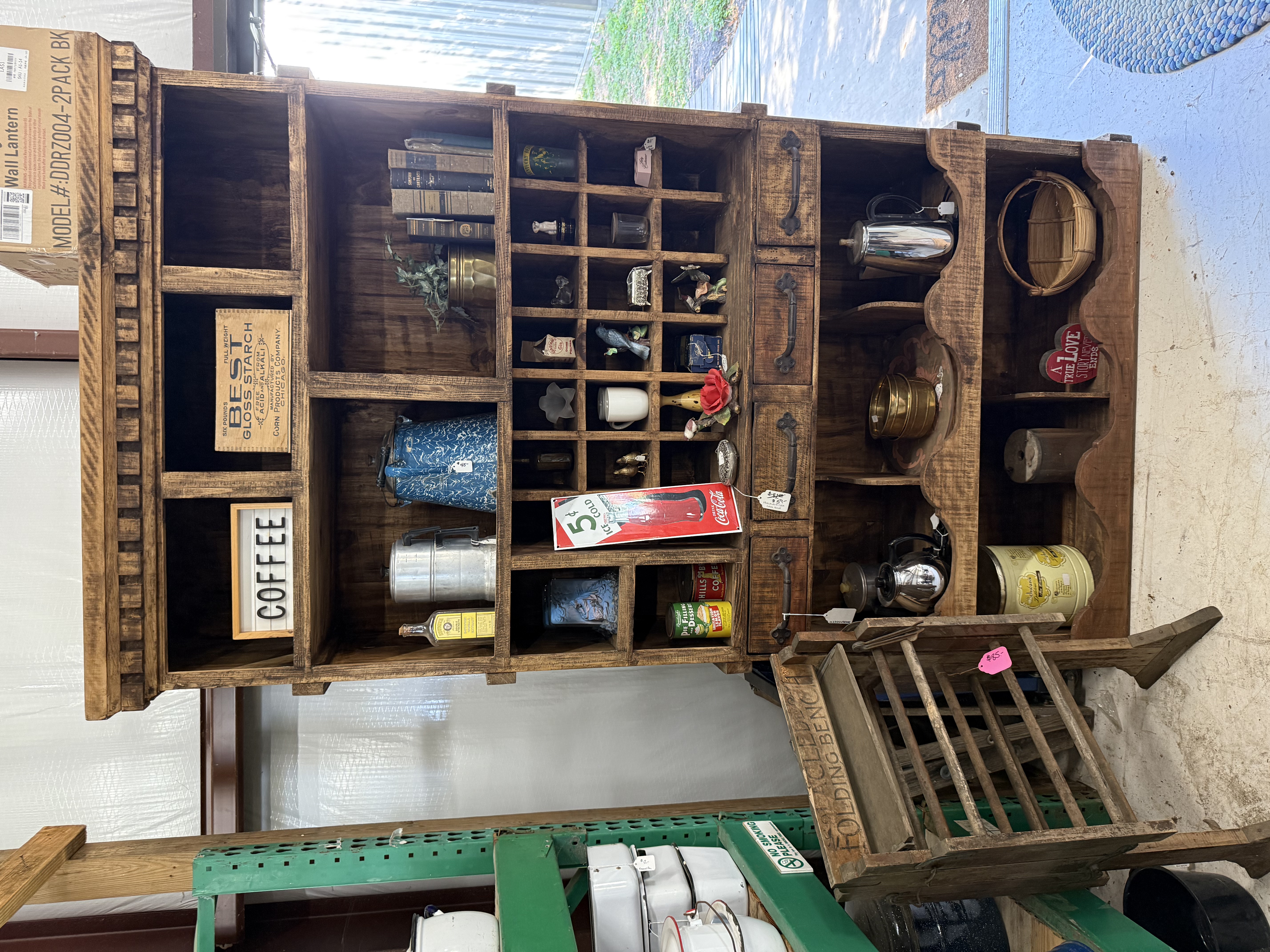 Vintage wooden display cabinet with collectibles