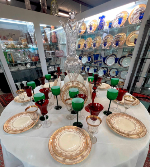 Cobalt blue glass, decanters, and cut crystal on silver trays