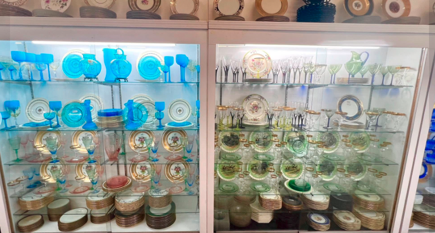 Vintage barware — etched tumblers, gold-rimmed glasses, and cocktail sets